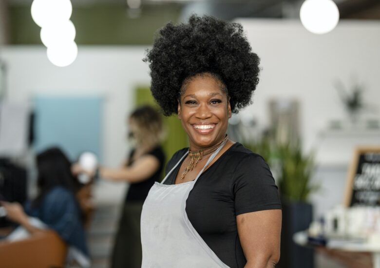 Smiling small beauty salon owner